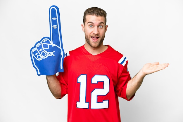 Sports fan man over isolated white background with shocked facial expression