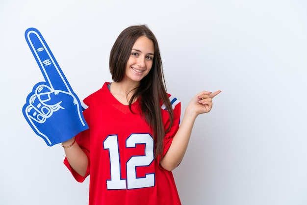 Sports fan Ukrainian woman isolated on white background pointing finger to the side