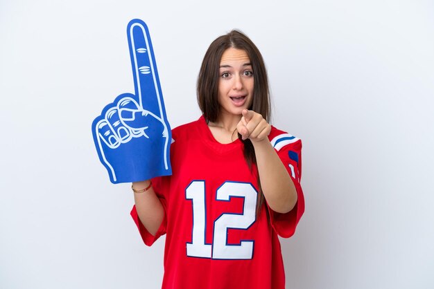 Sports fan Ukrainian woman isolated on white background surprised and pointing front