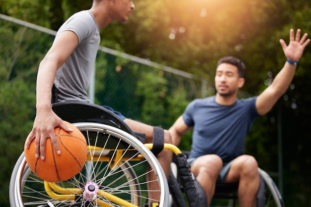Photo sports game wheelchair basketball player and people playing match competition challenge or practice skills outdoor action opponent and fitness athlete with disability training and exercise