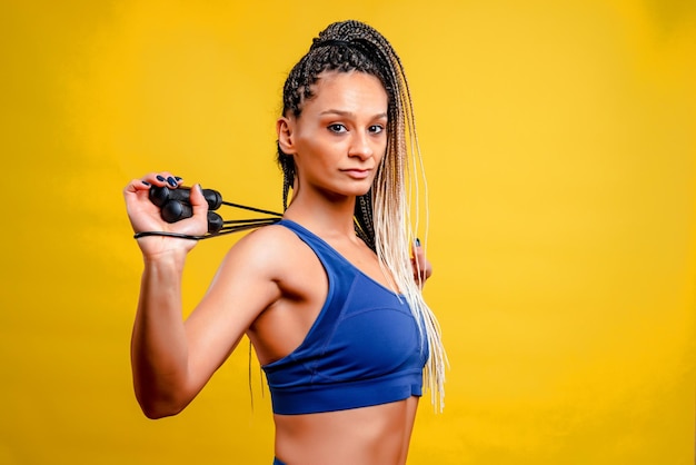 Sports girl on a yellow background