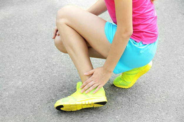 Sports injuries of girl outdoors