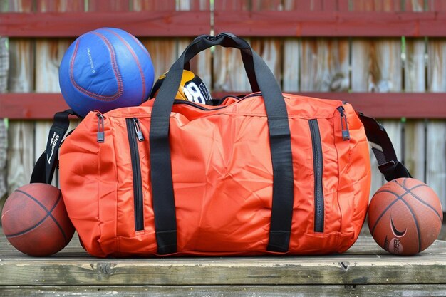 Sports items around gym bag