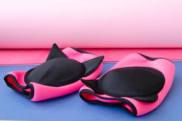 sports knee pads for fitness and sports pink on a sports mat