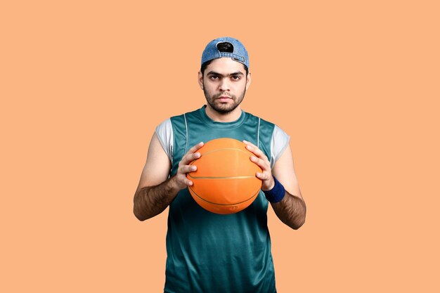 sports man holding basketball indian pakistani model