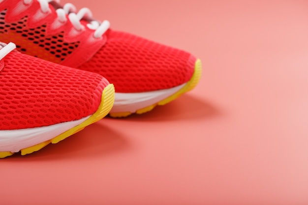 Sports pink sneakers isolated on pink