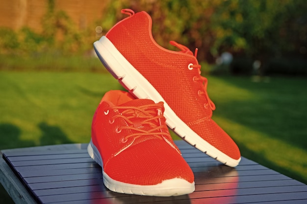 Photo sports shoes sneakers bright orange color