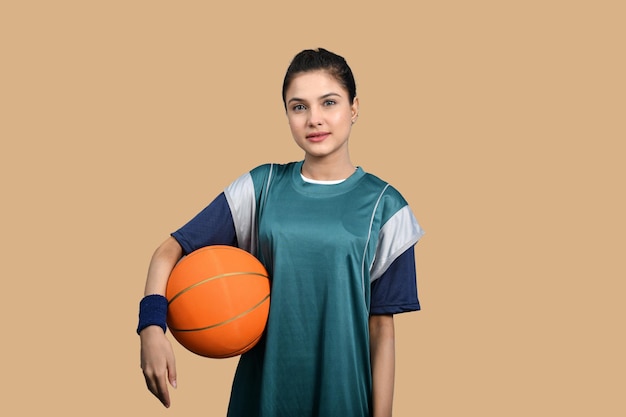 sports women holding basketball indian pakistani model