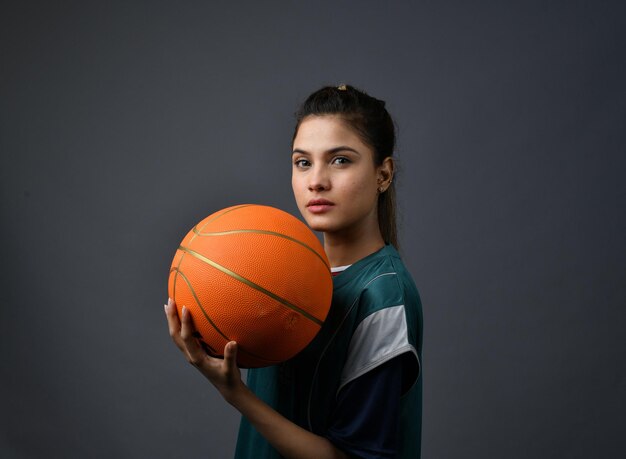 Sports women holding basketball indian pakistani model