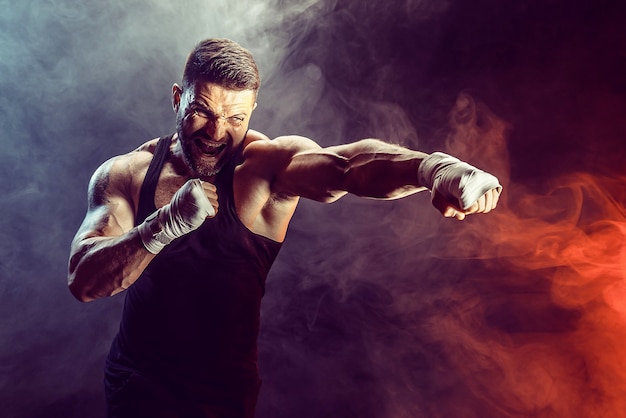 Sportsman boxer fighting on black wall with shadow. Copy Space. Boxing sport concept. 