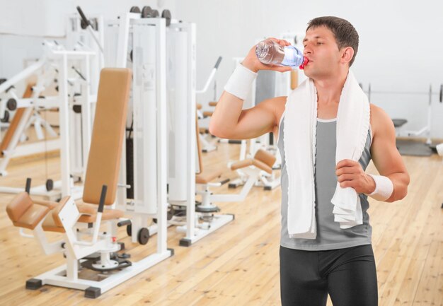 A sportsman drinking water from bottle