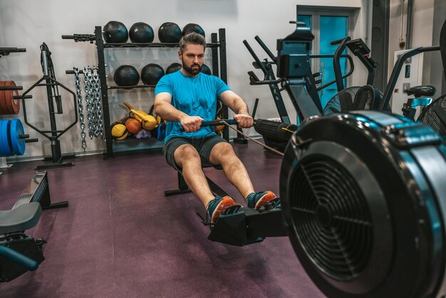 Sportsman having a workout in a gym and looking motivated