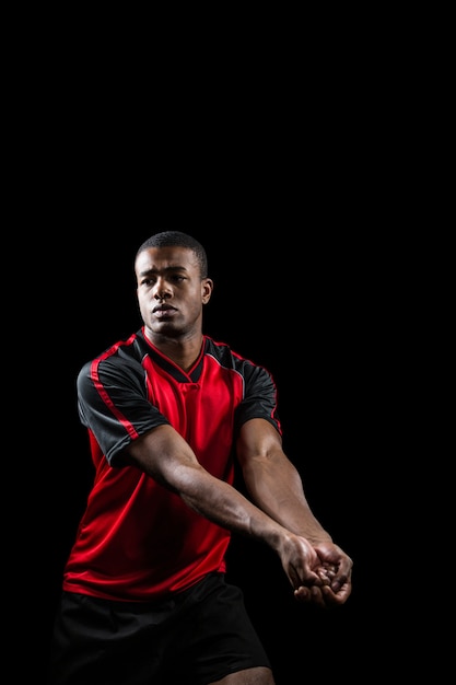 Sportsman posing while playing volleyball