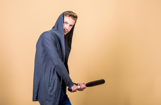 Sportsman strong looks threatening with bat Aggression masculinity strong temper Bully mood Bad boy concept Strong and confident Self defence Sport equipment Man bully guy with baseball bat