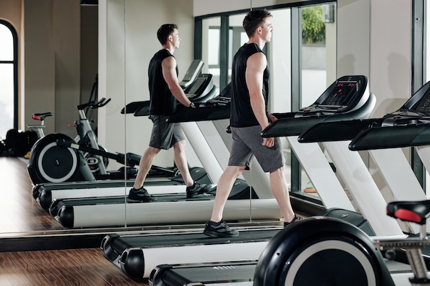 Sportsman walking on treadmill