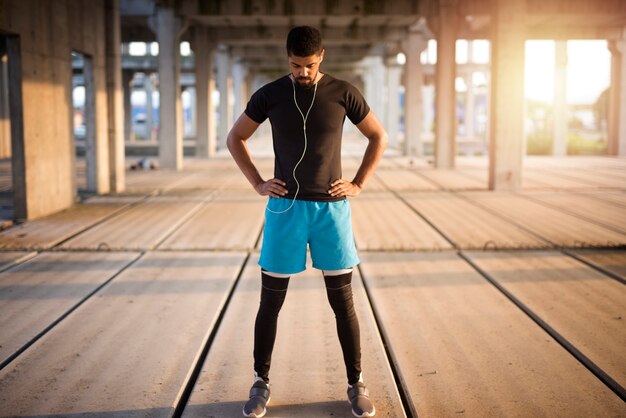 Sportsman warming up and preparing for training.