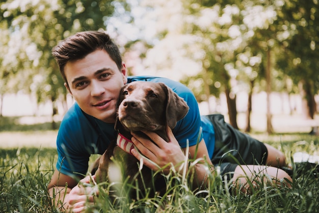 Sportsman with His Dog in Green City Park