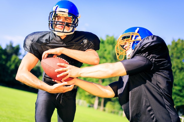 sportsmen playing on field