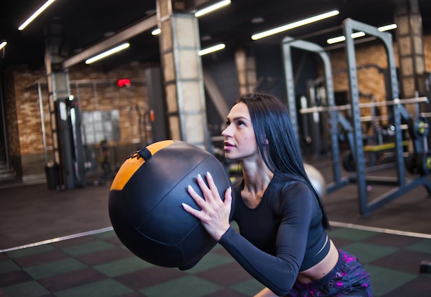 Sportswoman exercising at the gym