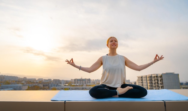 Sportswoman is doing yoga