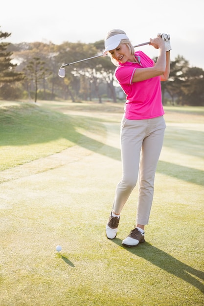 Sportswoman playing golf