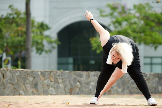 Sportswoman Stretching Hamstrings