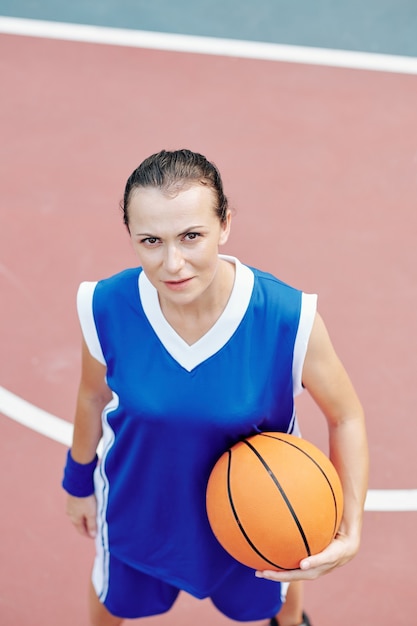 Sportswoman with basketball ball