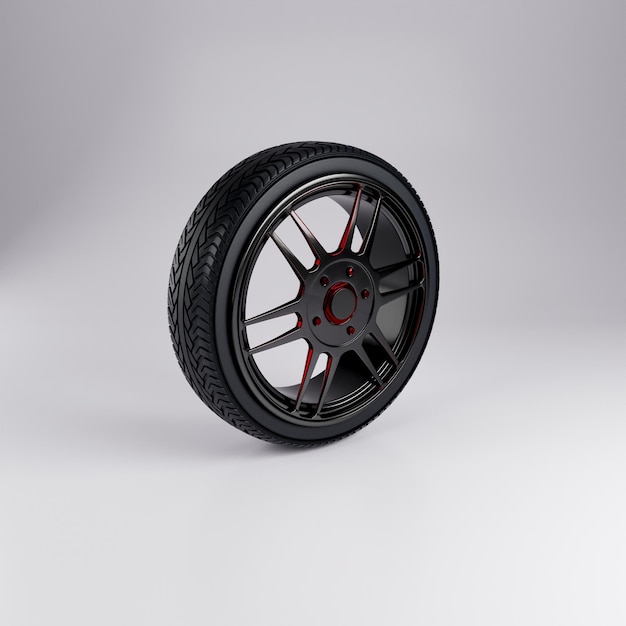 Sporty black and red car wheel with glossy rim on white background