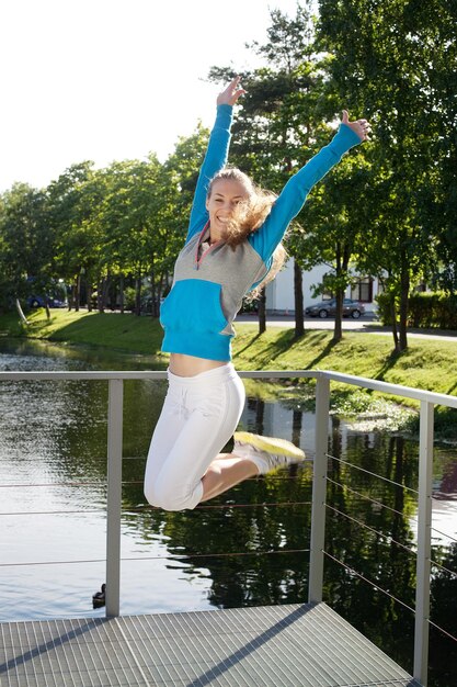 Sporty woman jump outdoor