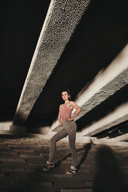 Sporty woman poses in sportswear