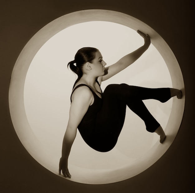 Sporty woman posing in a circle