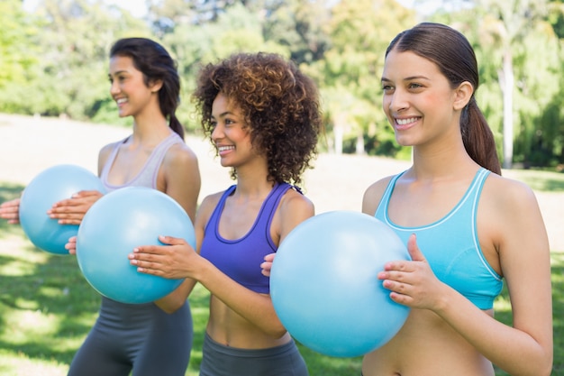 Sporty women exercising with medicine balls