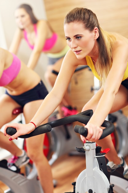 sporty women group on spinning class