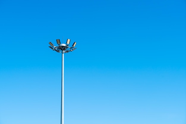 Spotlight pole with blue sky