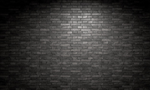 Spotlight shining on a black brick wall background