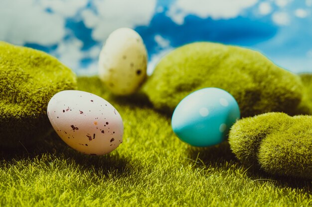 Spotted Easter eggs on the grass. Holiday concept