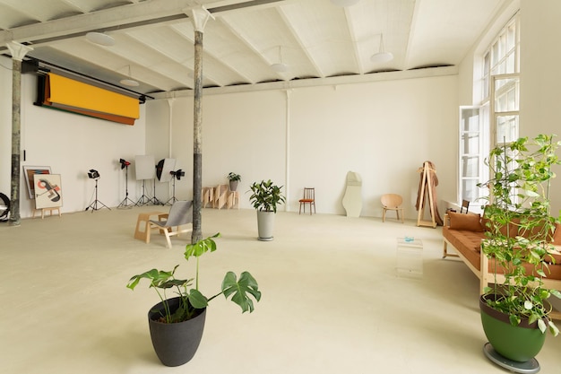 Sprawling photostudio with white walls and columns