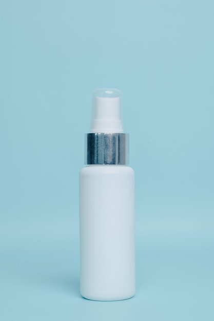 Spray bottle packaging for mock up isolated on pastel blue background