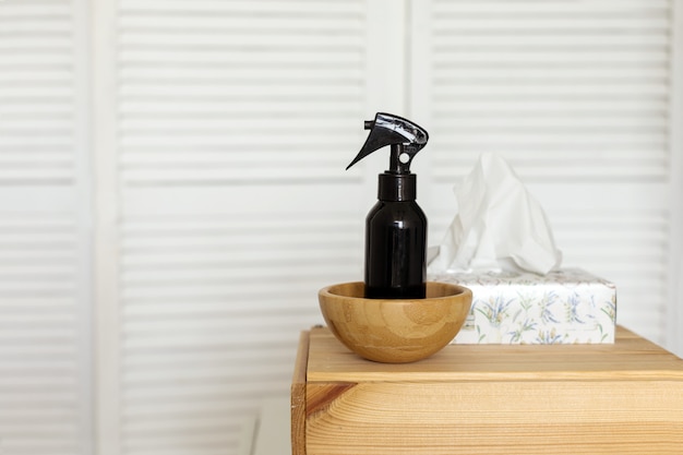 Sprayer and tissues on shelf