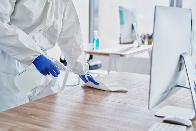 Spraying disinfection on surface in the office