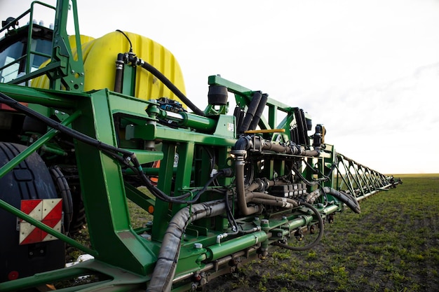 Spraying farm on a tractor closeup