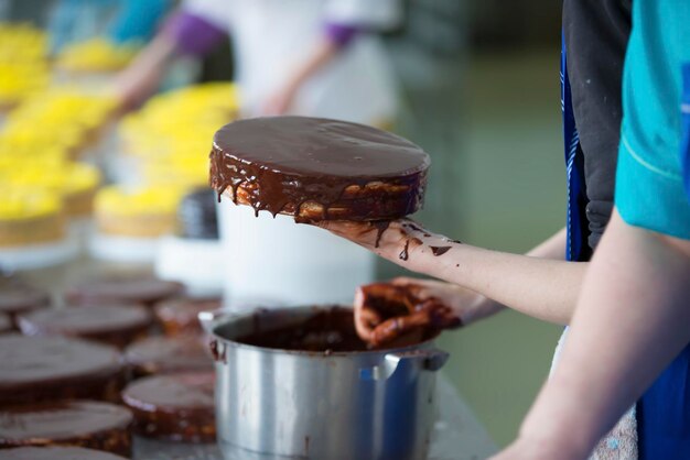 Spread chocolate cake with chocolate cream