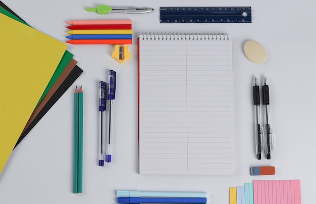 spread out school supplies and a notepad in the center