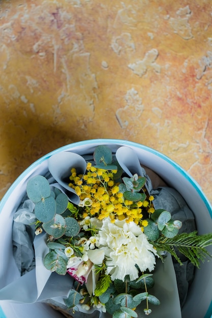 Spring bouquet, mimosa and daffodils, in a flower pot