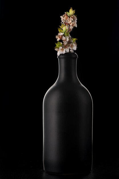 Spring cherry blossom in black bottle