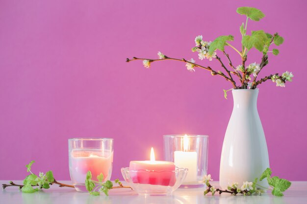 Spring cherry flowers and candles