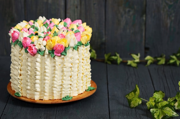 Spring cream cake with tulip flowers