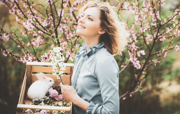 Spring day Pretty woman working and playing in beautiful garden