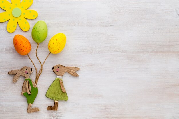 Spring and Easter decor. Wooden symbols bunny, flowers and butterflies.