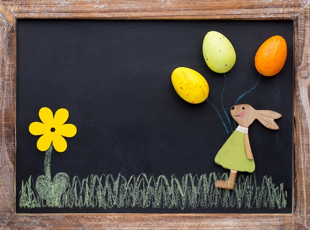 Spring and Easter decor. Wooden symbols bunny, flowers and butterflies.